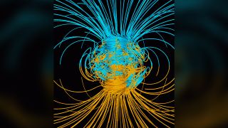 A computer simulation shows the Earth's magnetic field in a period of normal polarity between reversals. The lines represent magnetic field lines: blue when the field points towards the center and yellow when it points away.