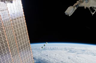 The three small-looking satellites in this image are cubesats developed by Japan, Nepal and Sri Lanka for the BIRDS-3 project. This picture comes from aboard the International Space Station as it orbited 256 miles (412 kilometers) above the Amazon River in Brazil.