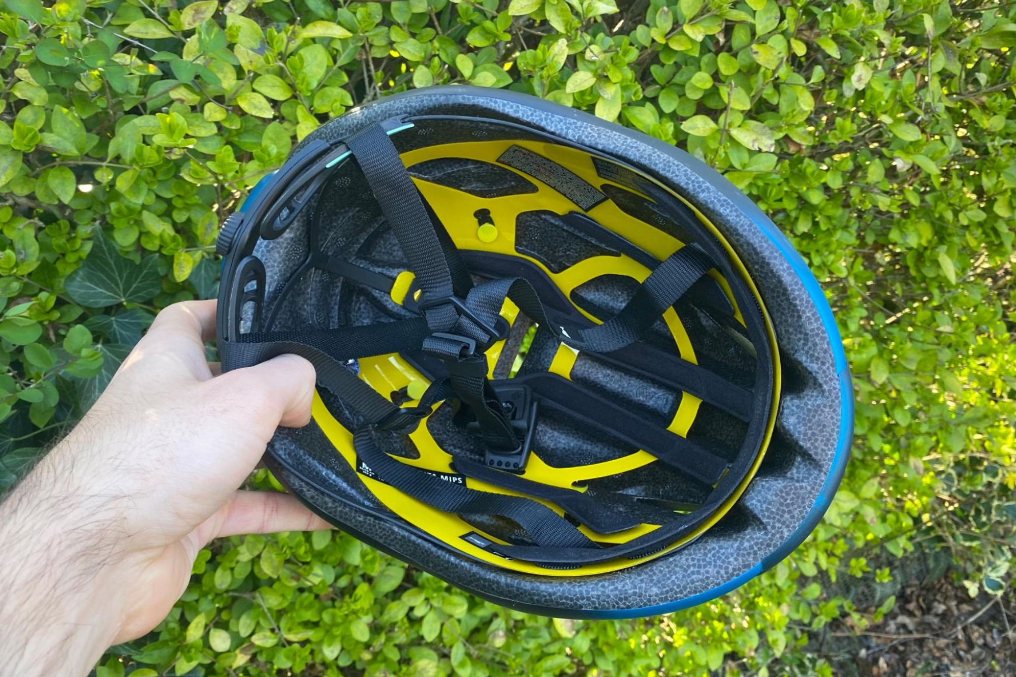 MET Manta MIPS helmet being held by a male cyclist