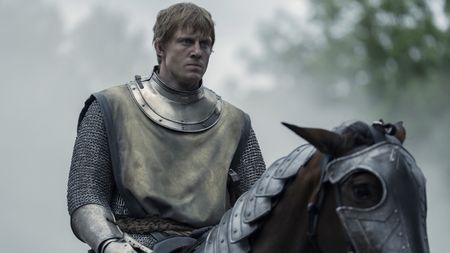 Ser Duncan the Tall looking determined while sitting on an armored horse in A Knight of the Seven Kingdoms
