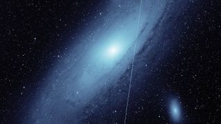 A Starlink satellite streaks across this image of the Andromeda galaxy from Caltech's Zwicky Transient Facility, highlighting the challenge Starlink satellites in particular present to ground-based astronomical observations.