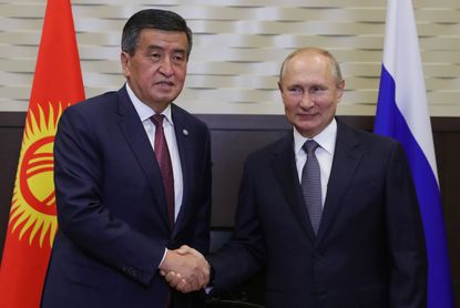 Kyrgyzstan President Sooronbai Jeenbekov and Russia's Putin