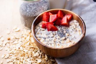 porridge breakfast made with chia seeds with chopped strawberries on the top