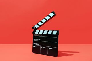 Clapper board On Red Background