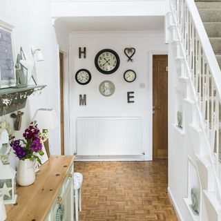 room entrance with wooden door and bright white walls