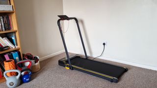 UREVO Strol 2E treadmill being tested by our reviewer