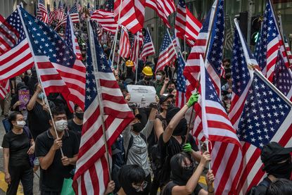 Hong Kong protesters march on U.S. consulate.
