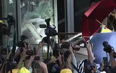Hong Kong protesters smash window at legislature