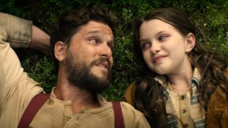 Kit Harington and Caoilinn Springal looking at each other l in The Beast Within.