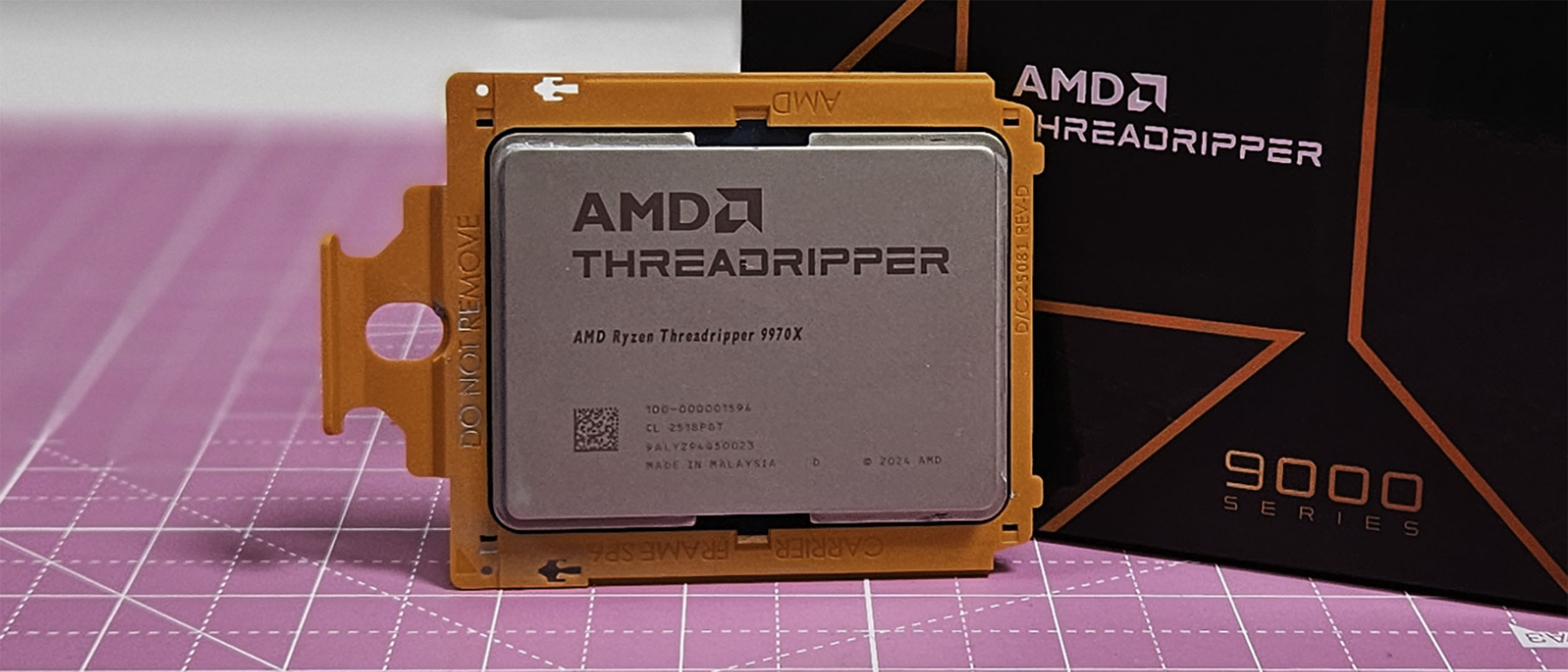 An AMD Ryzen Threadripper 9970X on a table with its retail packaging