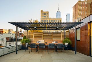 An outdoor kitchen with Manhattan skyline