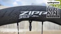 A close up of the sidewall on the Zipp 353 NSW wheels showing the tubeless valve, the logo wordmark and the hexagonal indentations