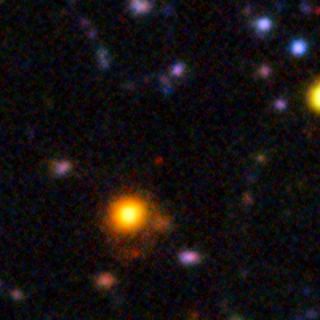 This image from the European Southern Observatory's Very Large Telescope shows the galaxy NTTDF-6345, one of the most distant ever to have had its distance measured accurately. This extremely faint object is one of five that have been used to chart the timeline of the re-ionization of the universe about 13 billion years ago.