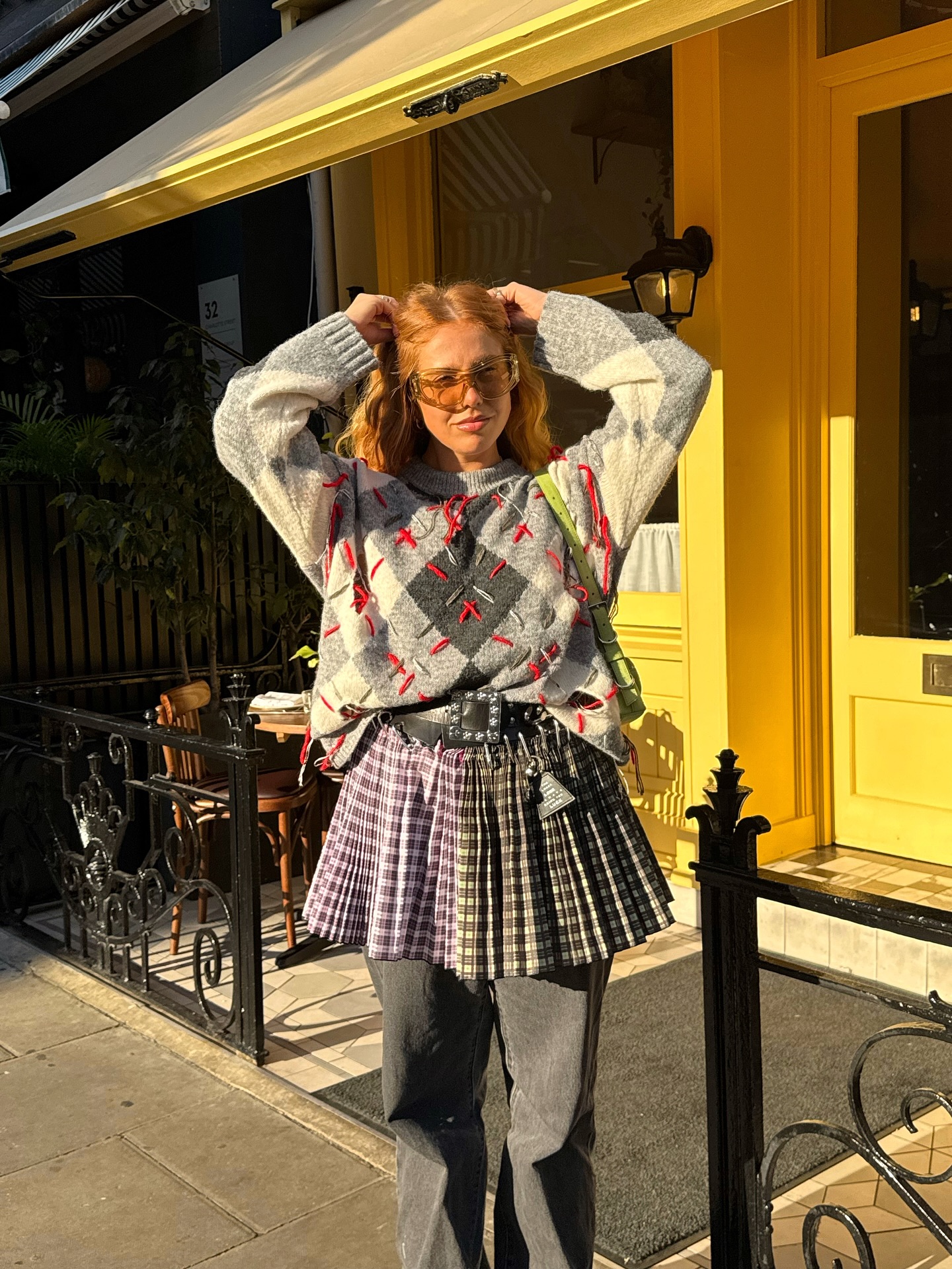 Girl posing for outfit pic in the sun