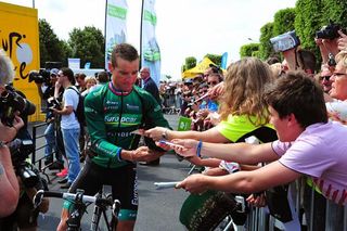 Thomas Voeckler (Europcar) signs autographs before the start of stage 4.