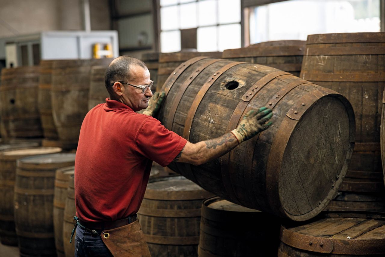 Peter Stephen, one of the coopers at Speyside Cooperage, stacks a finished barrel.