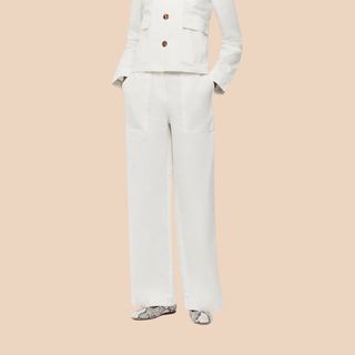 Flay lay image of woman wearing white trousers