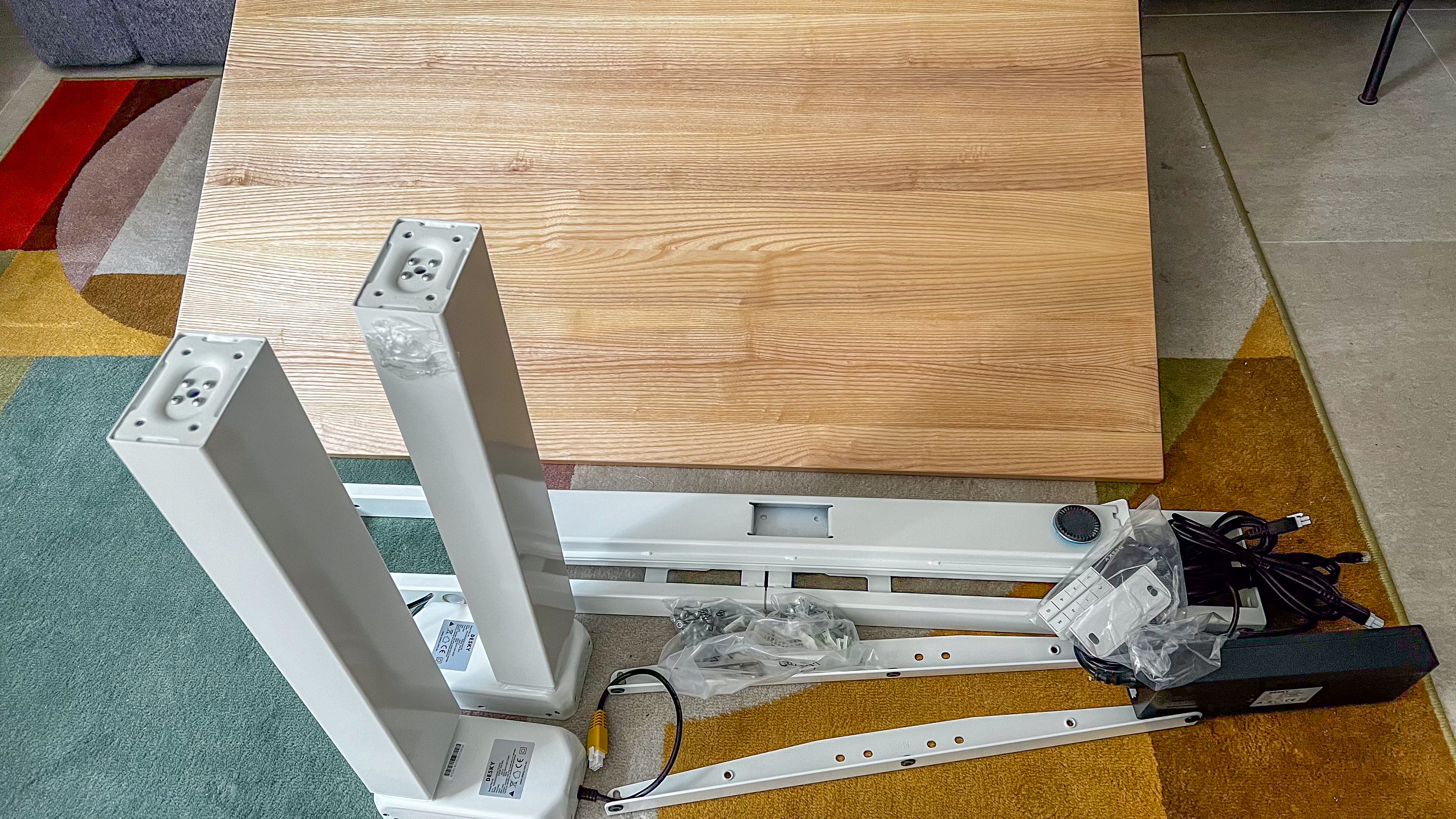 The various parts of the Desky Dual Bamboo standing desk before assembly