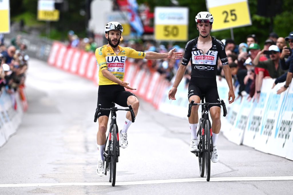 VILLARSSUROLLON SWITZERLAND JUNE 15 LR Stage winner Adam Yates of The United Kingdom and UAE Team Emirates Yellow Leader Jersey and Joao Almeida of Portugal and UAE Team Emirates Black Points Jersey cross the finish line during the 87th Tour de Suisse 2024 Stage 7 a 1182km stage from VillarssurOllon to VillarssurOllon 1248m UCIWT on June 15 2024 in VillarssurOllon Switzerland Photo by Tim de WaeleGetty Images