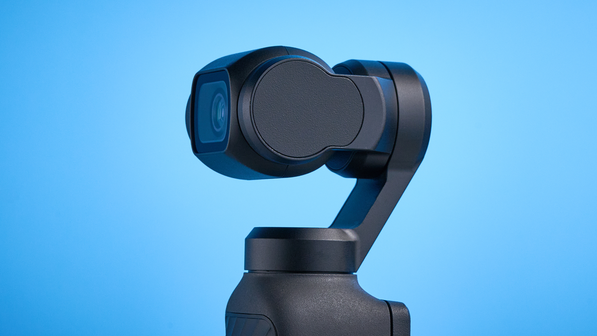 DJI Osmo Pocket 4 against a blue background