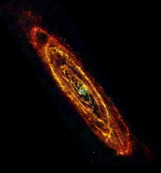 ESA Herschel space observatory image of Andromeda (M31) using both PACS and SPIRE instruments to observe at infrared wavelengths of 70 mm (blue), 100 mm (green) and 160 mm and 250 mm combined (red). Image released Jan. 28, 2013.