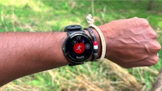 Man wearing Polar Ignite 3 Titanium GPS watch