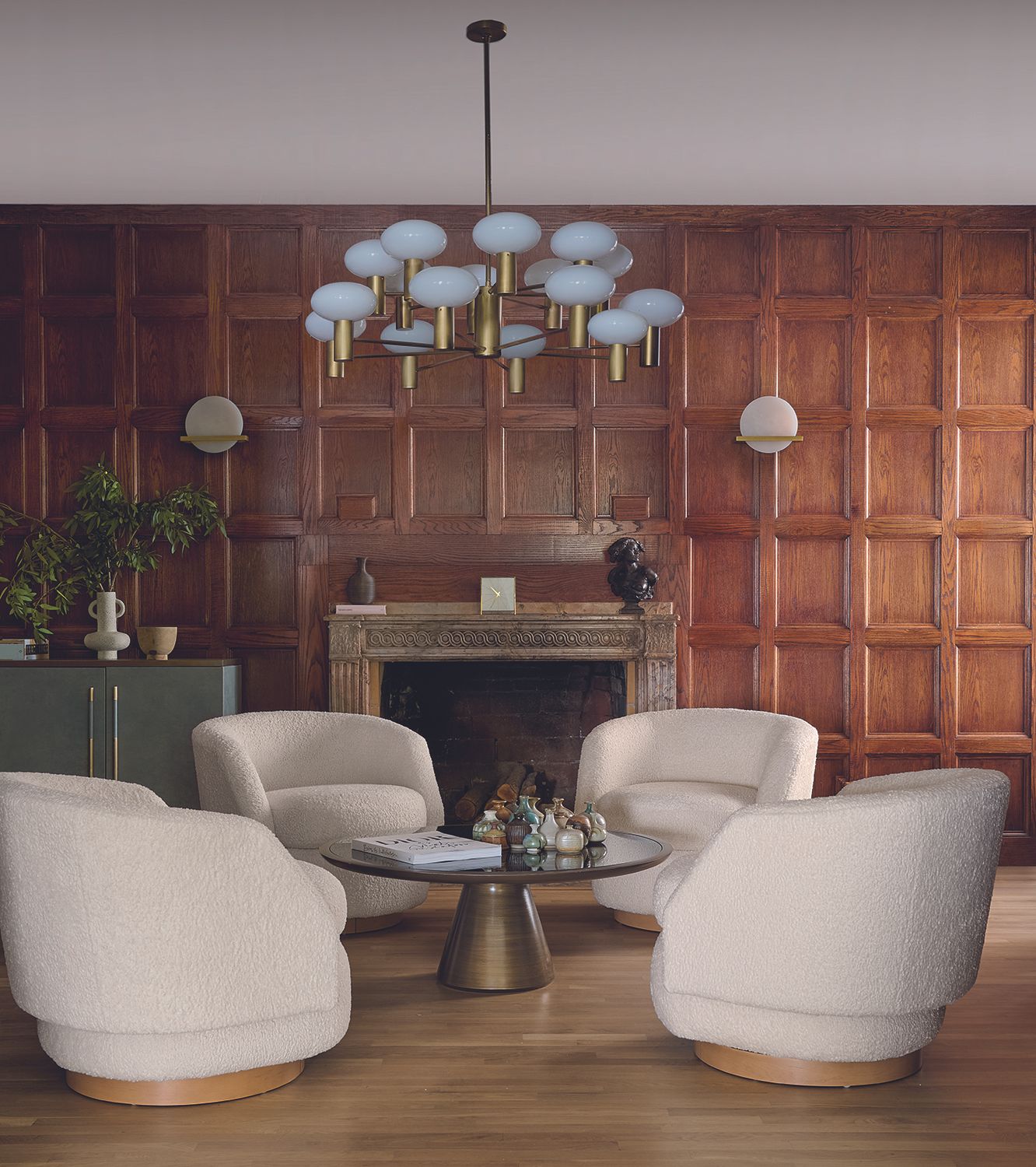 livng room ideas four white armchairs wood panelling