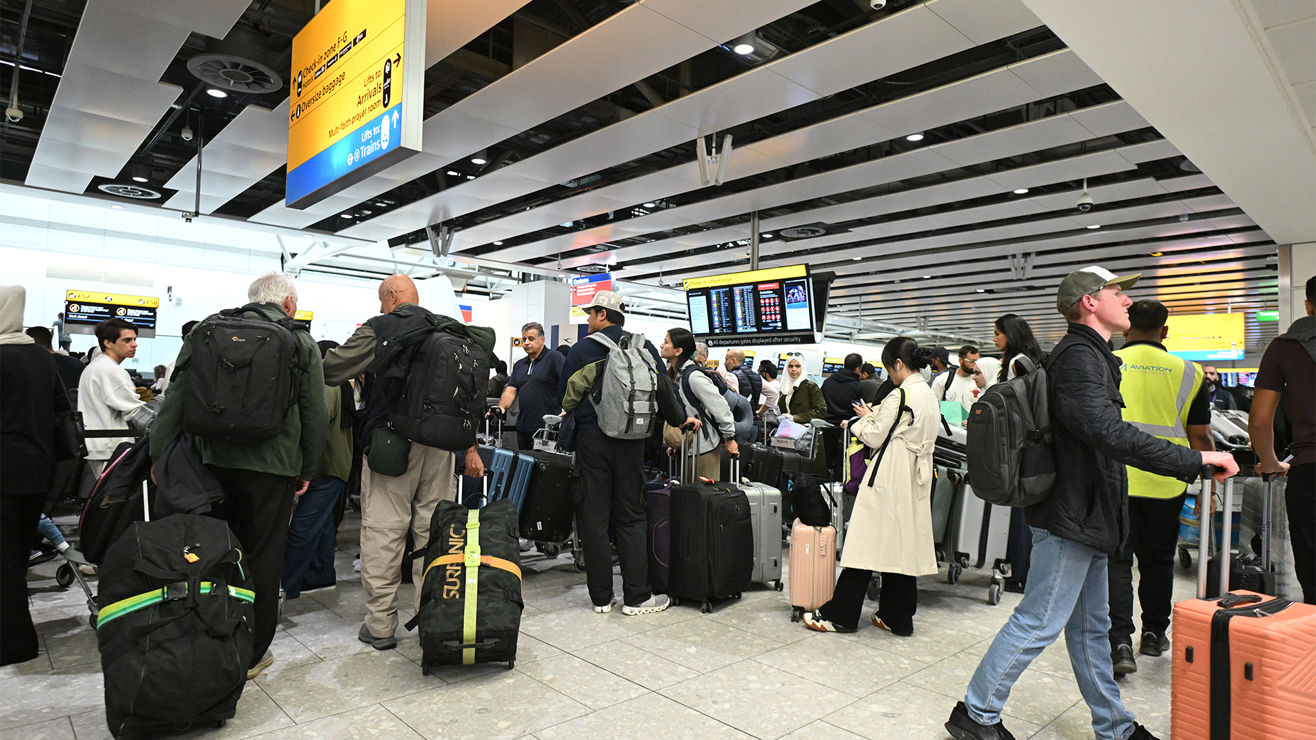 Passengers queuing and waiting for updates at Heathrow Airport after a cyber attack on Collins Aerospace disrupted operations on 20th September 2025. 