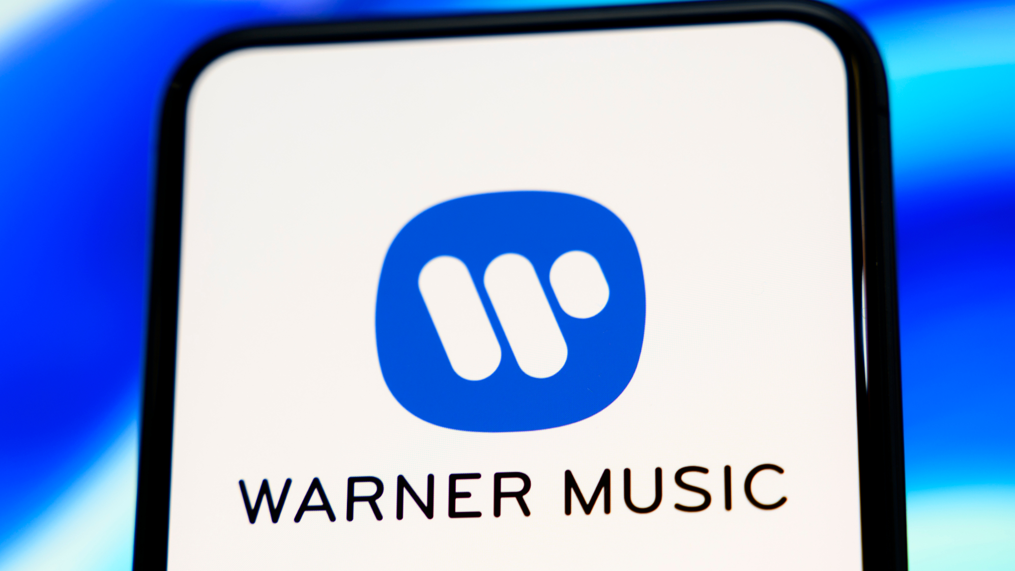 Warner Music Group logo on a phone