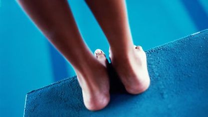 feet on diving board
