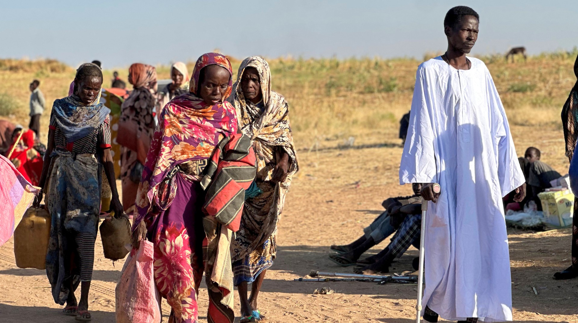 Displaced Sudanese who fled El-Fasher after the city fell to the Rapid Support Forces (RSF), arrive in the town of Tawila in war-torn Sudan's western Darfur region on October 28, 2025. Fears mounted in Sudan on October 28, three days after paramilitaries seized the key city of El-Fasher, amid reports of mass atrocities and the killing of five Red Crescent volunteers in Kordofan. The capture of El-Fasher, the historic heart of Darfur, has sparked fears of mass killings reminiscent of the region's darkest days. (Photo by AFP) (Photo by -/)
