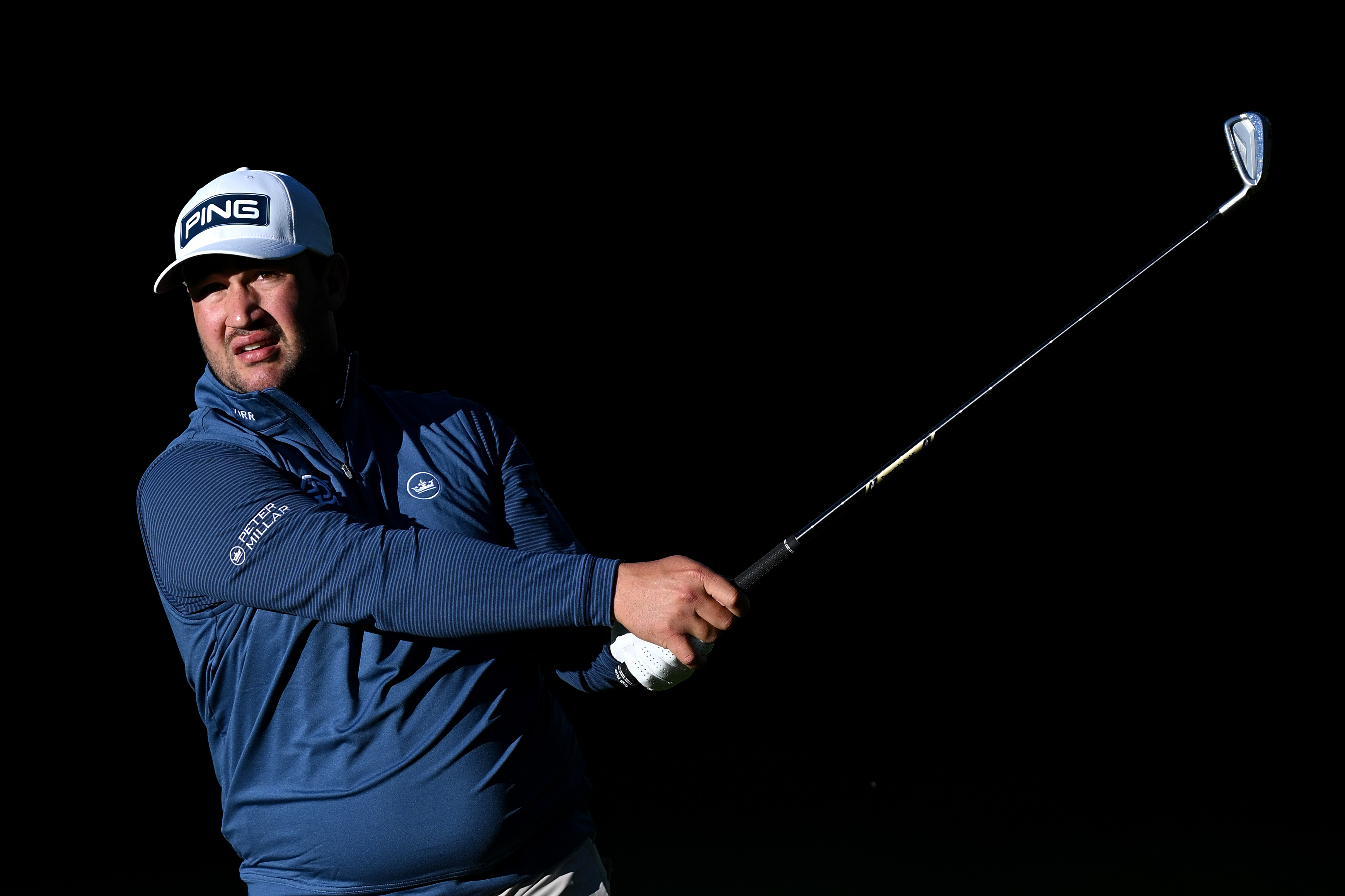 Thriston Lawrence hits an iron shot into the green