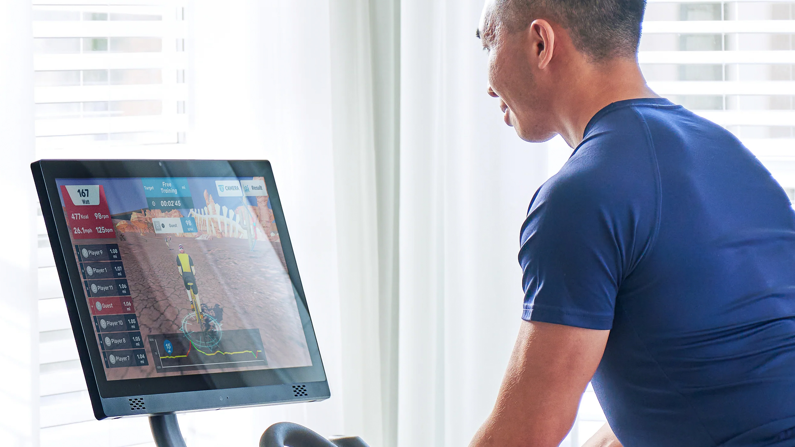 Rider using the Echelon EX-5s Smart Connect indoor bike