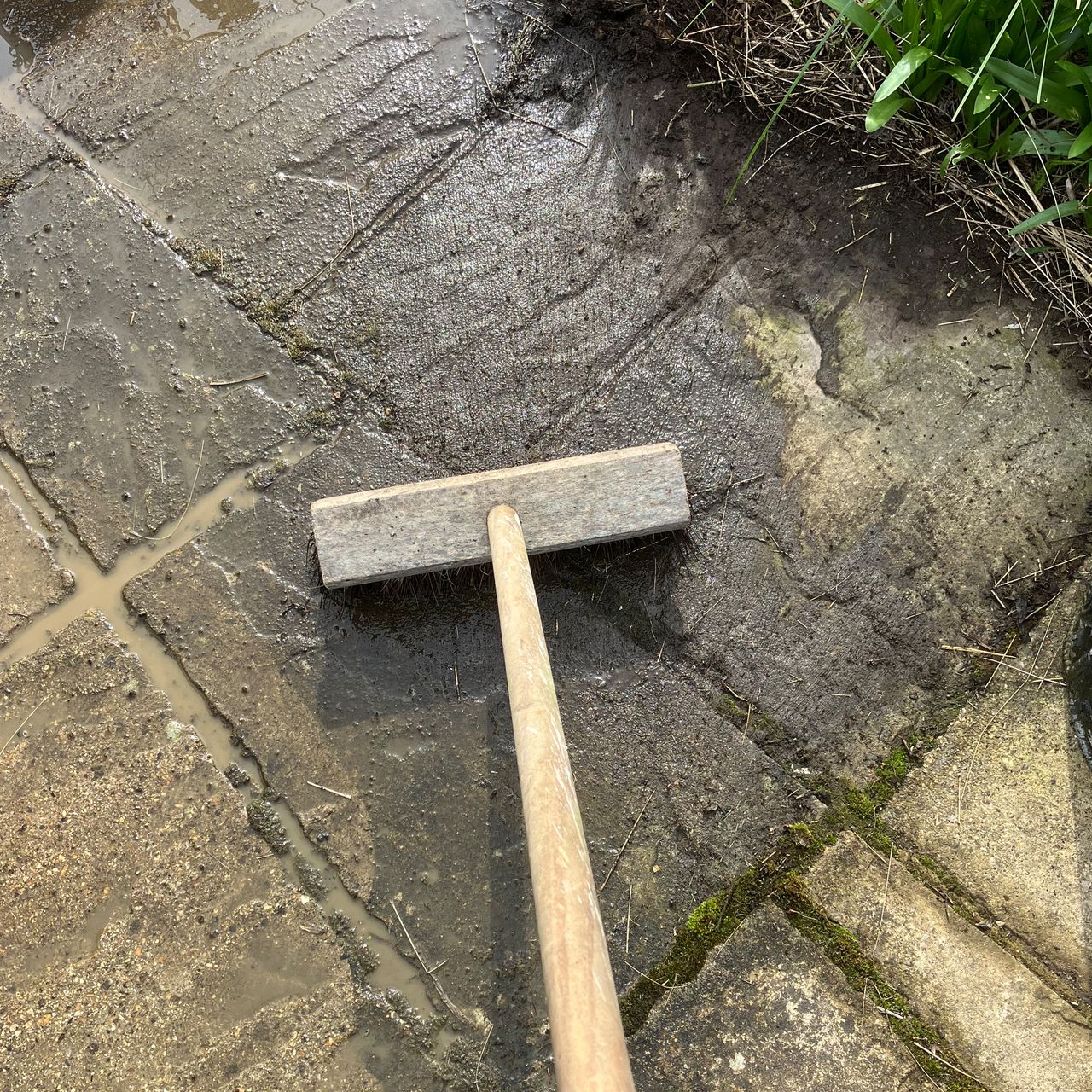 Pressure washer testing on patio, wood and a car