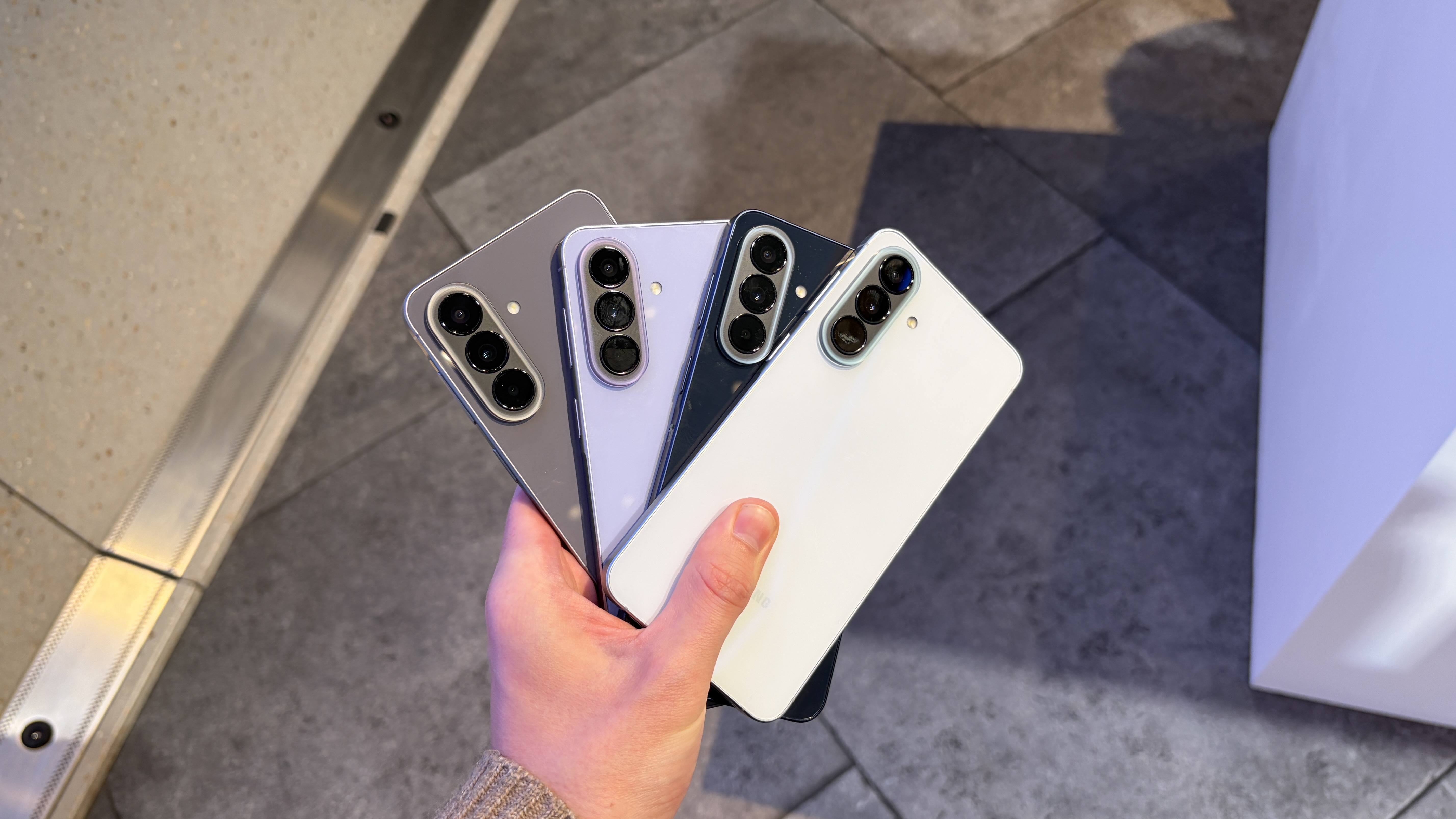 The Samsung Galaxy A57 being held in the hand