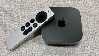 Apple TV 4K 2022 and Siri remote on white background