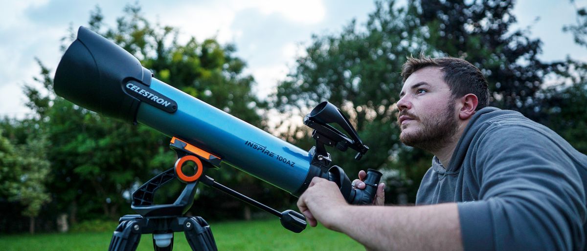 man using Celestron Inspire 100AZ telescope