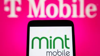 A phone displaying Mint Mobile in front of a T-Mobile add
