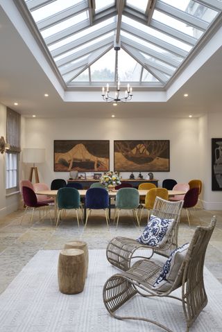 orangery ideas statement art and colourful dining chairs by Westbury Garden Rooms