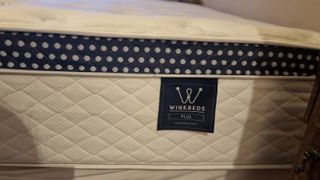 A close up of the side of the corner of the Winkbed Plus mattress