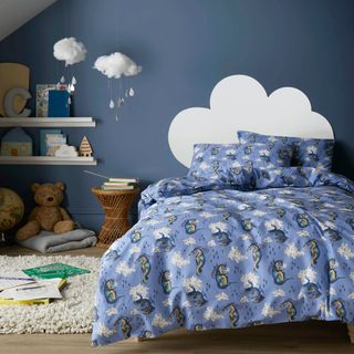 Cath Kidston peace dragons bedding in blue bedroom with cloud motif