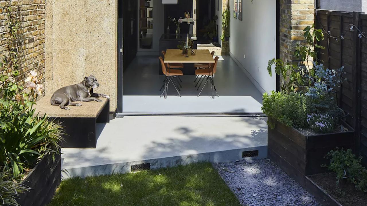 Small patio leading from kitchen with bifold doors