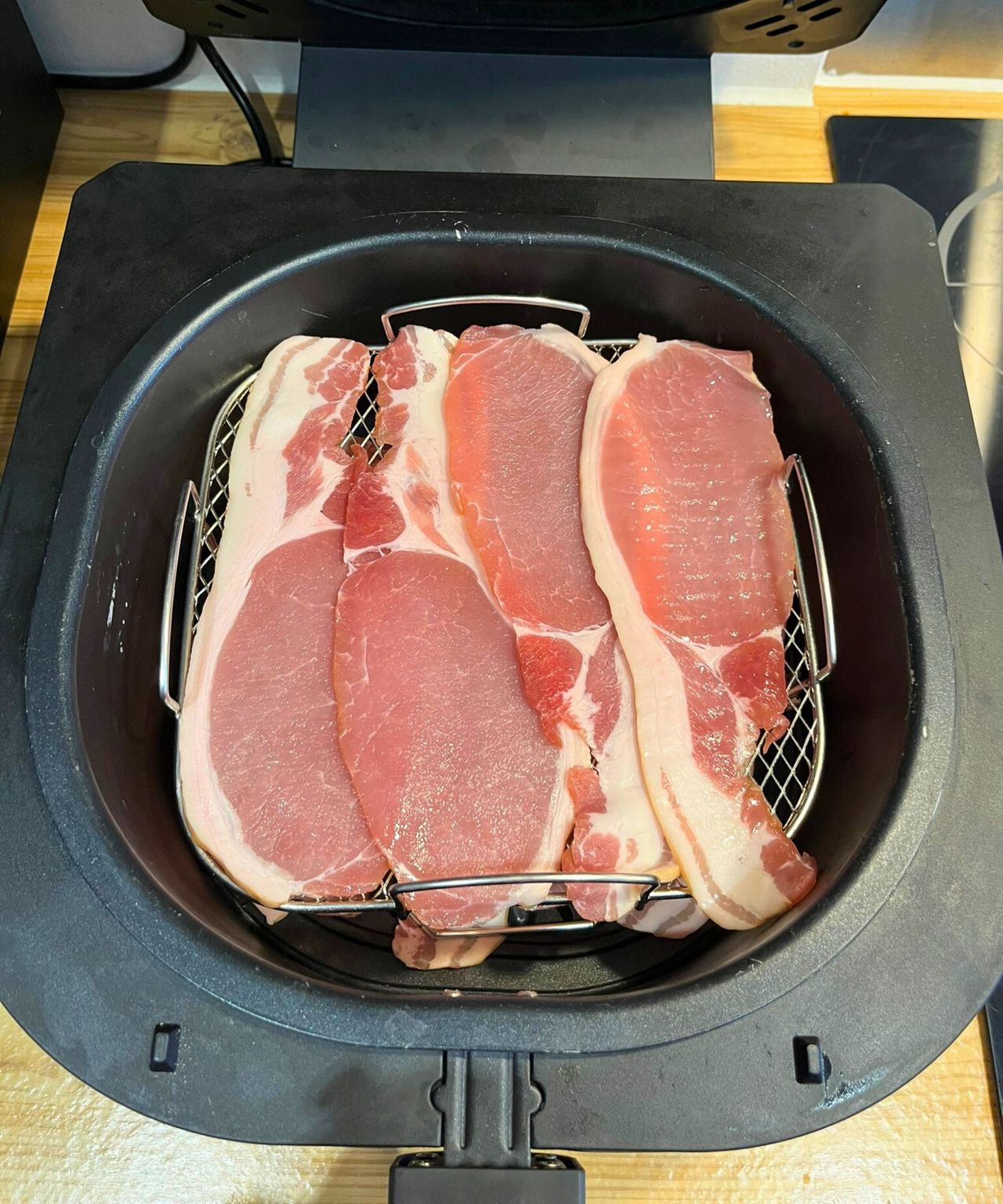 A secondary layer of bacon on the air fryer rack