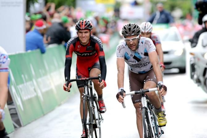 A smiling Tejay van Garderen (BMC) and Jean-Christophe Peraud (AG2R - La Mondiale) cross the finish line in Meiringen