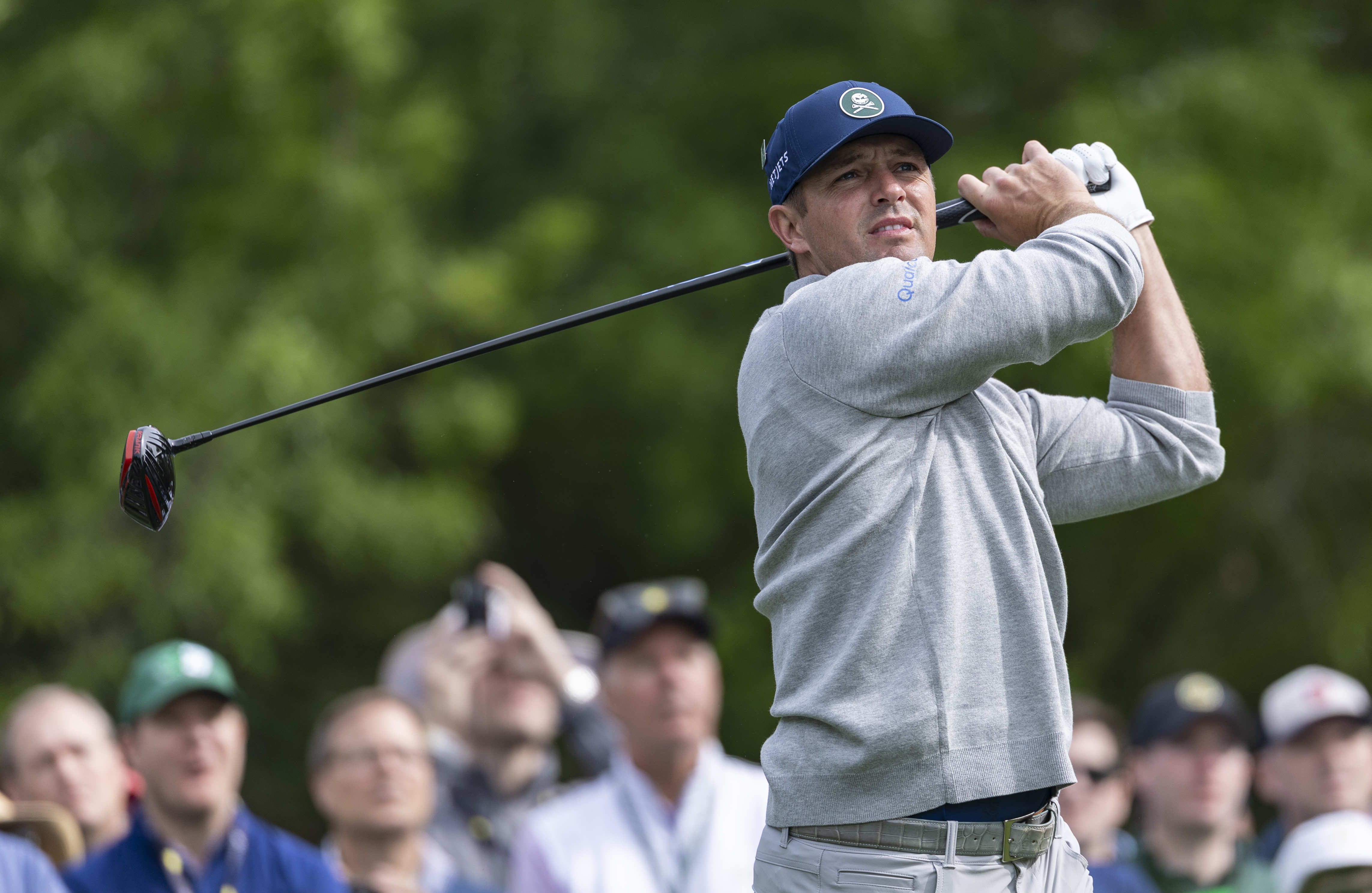 Bryson DeChambeau plays a stroke from the No. 5 tee during a practice round prior to the Masters at Augusta National Golf Club