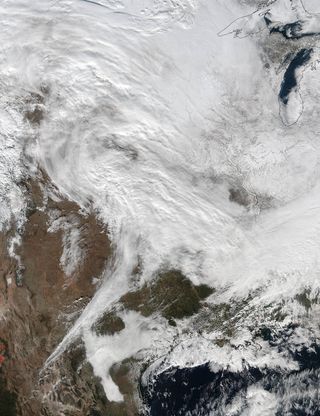 The NASA-NOAA Suomi NPP satellite captured this view of a massive winter storm yesterday (Jan. 20) at 2:30 p.m. EST.