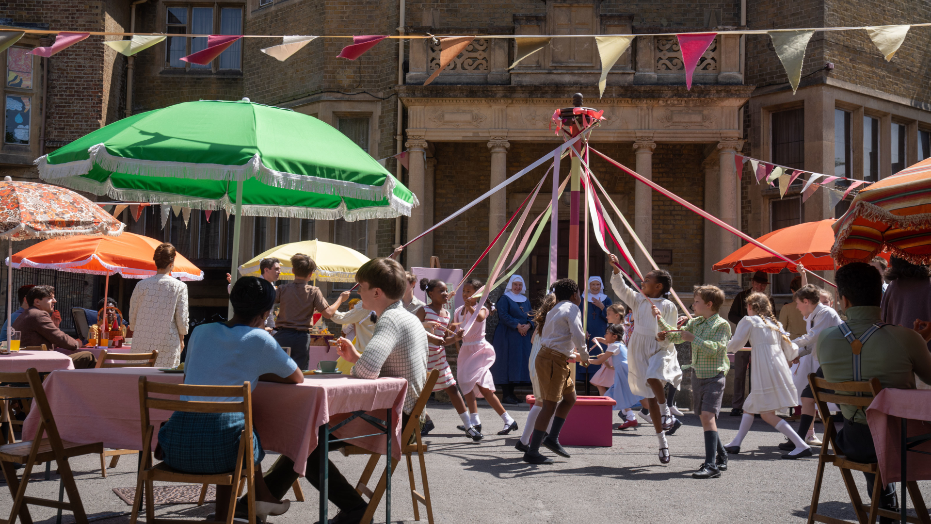 Whistun celebrations in Call the Midwife with children dancing around a maypole