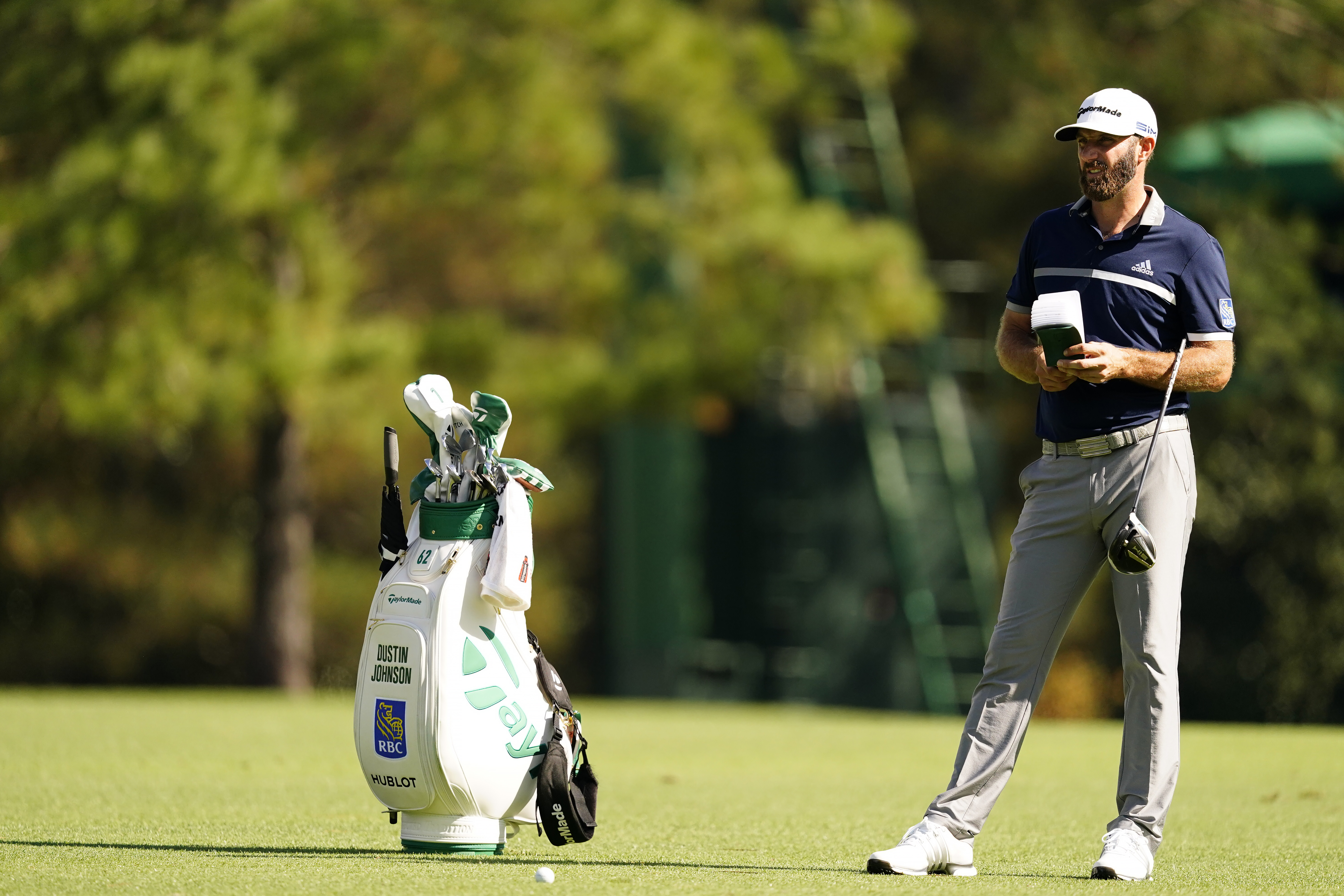 Dustin Johnson waits to hit his second stroke on the No. 15 hole during Round 2 of the Masters at Augusta National Golf Club, Friday, November 13, 2020. (Photo by Augusta National via Getty Images)