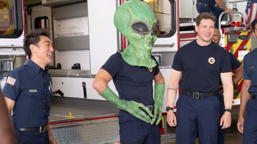 An alien stands with Chim and Buck