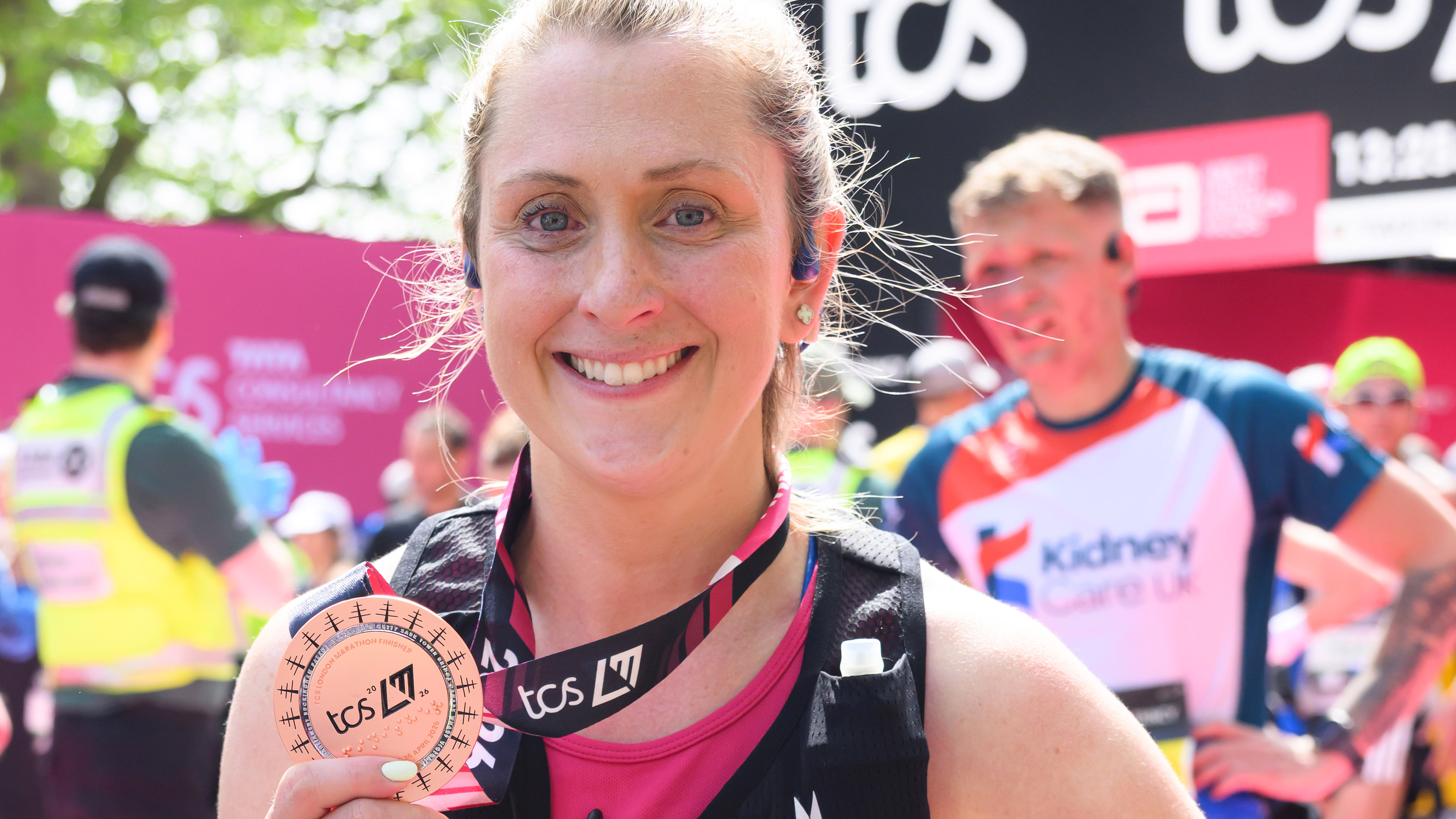 Dame Laura Kenny poses with her medal after completing the 2026 TCS London Marathon 